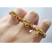 Guld lynlås fingerring