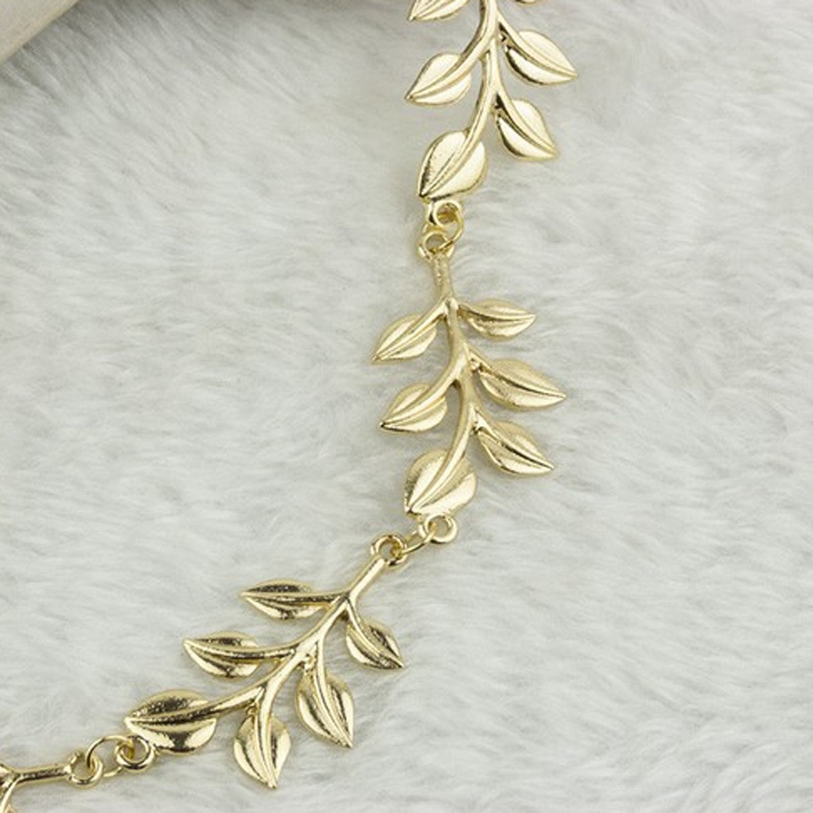 Hårbånd med guld grene og blade